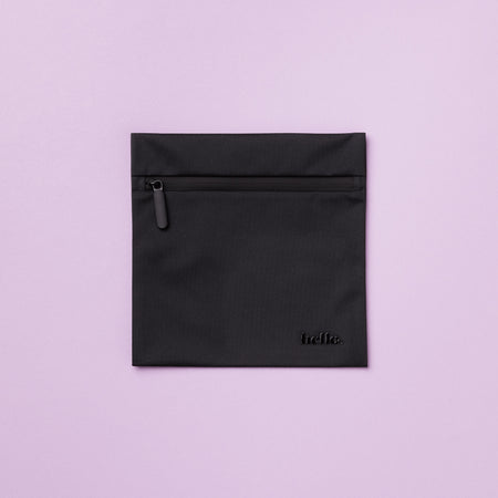 A black waterproof storage bag with a black zipper and the word 'hello' printed in on the front. The bag is displayed against a lilac background.
