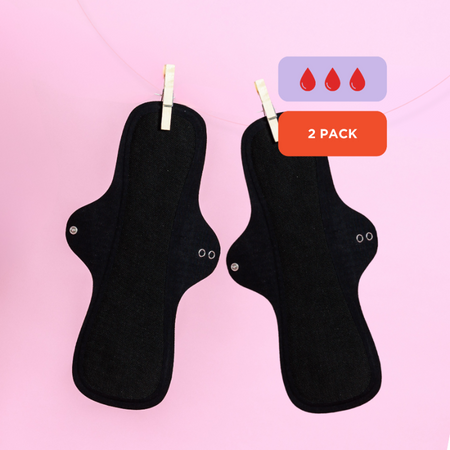 Two black sanitary pads on a pink background with a '2 Pack' label.