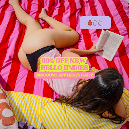 Person lying on a bed reading a book wearing a black period thong with promotional text overlay.