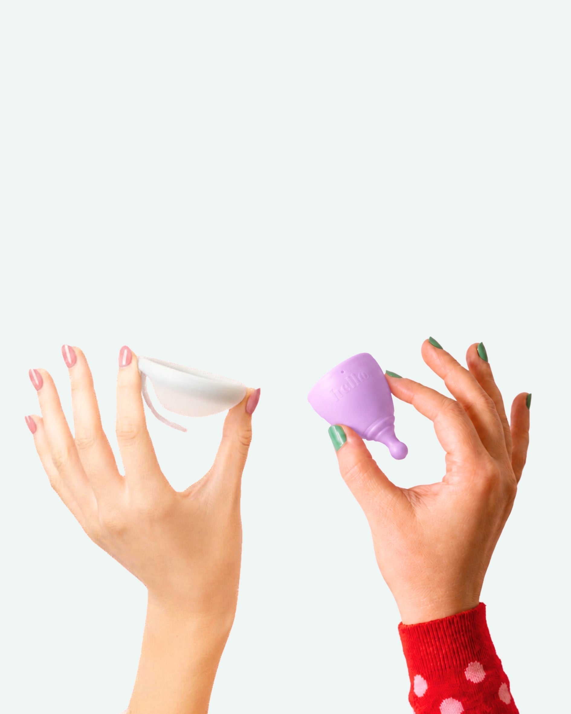 Hands holding a menstrual cup and menstrual disc