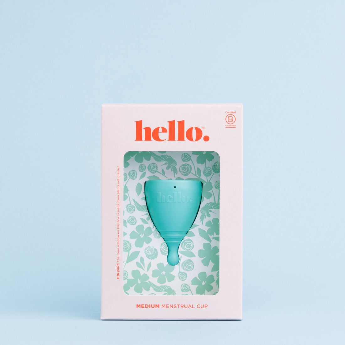 Packaging of Hello Period menstrual cup with one cup in teal colour, displayed in a box with a floral pattern against a soft blue background