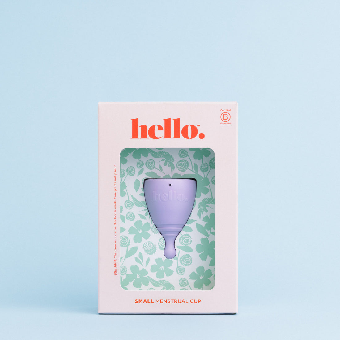 Packaging of Hello Period menstrual cups with one cup in purple displayed in a box with a floral pattern background